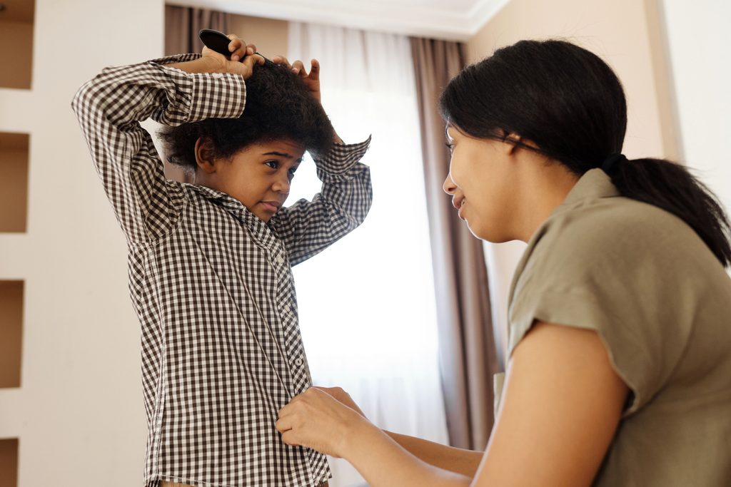 Parent setting a boundary with a child during a conversation about behavior