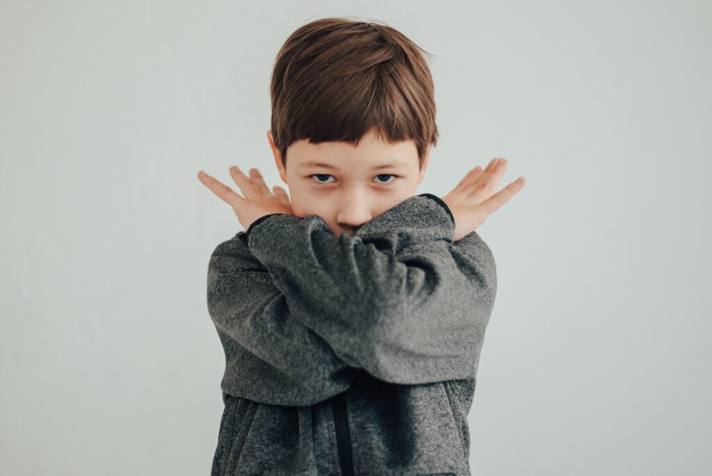 Child acting up and expressing frustration through body language
